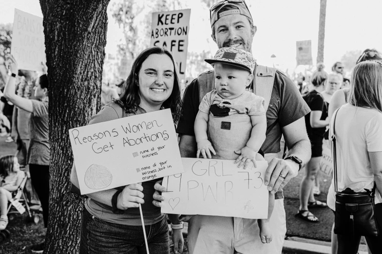 a black and white po of people protesting on the side of the road