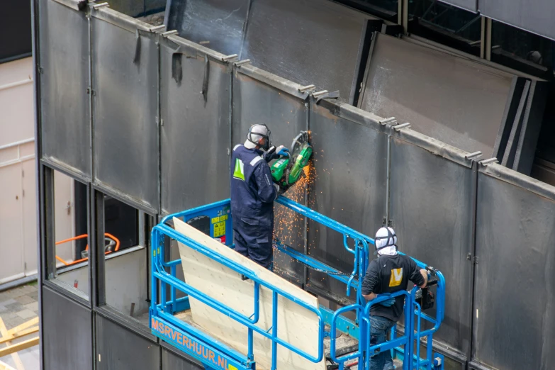 two men are preparing to fill up the air