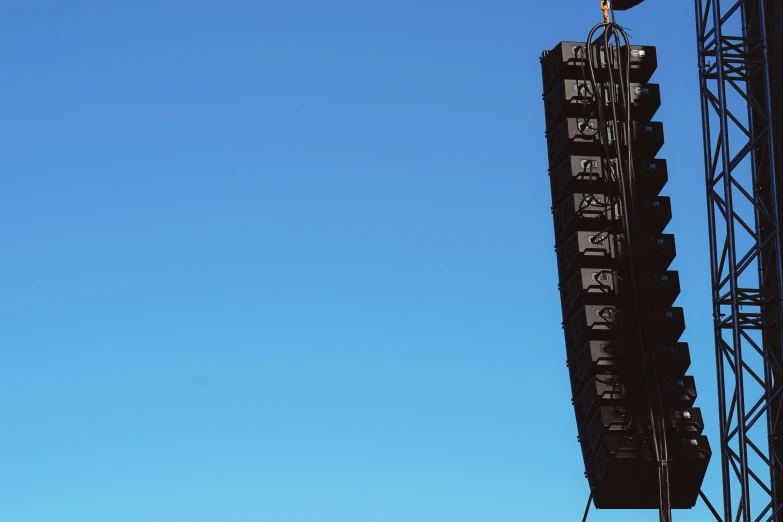 an airplane is flying in the air near the large signs