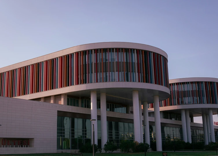 a round building sitting next to a highway