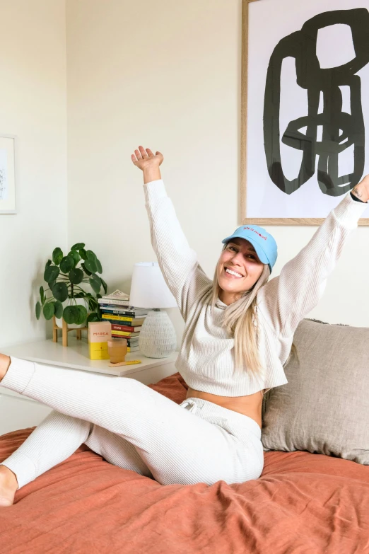 a woman on her stomach holding up her arms