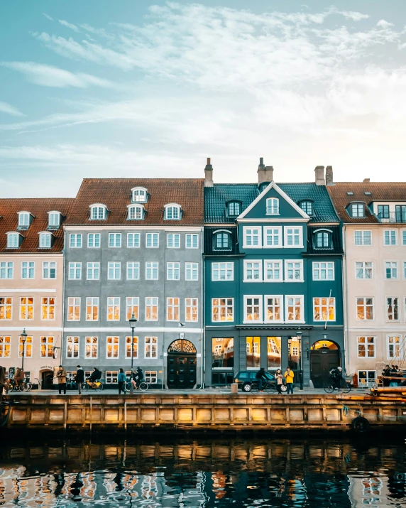 the boat is parked in front of two rows of older buildings