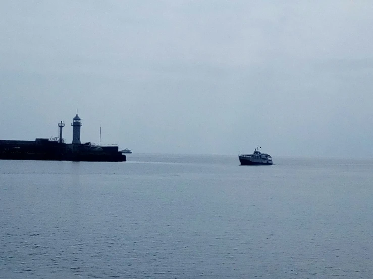 two ships off in the distance from each other on the water