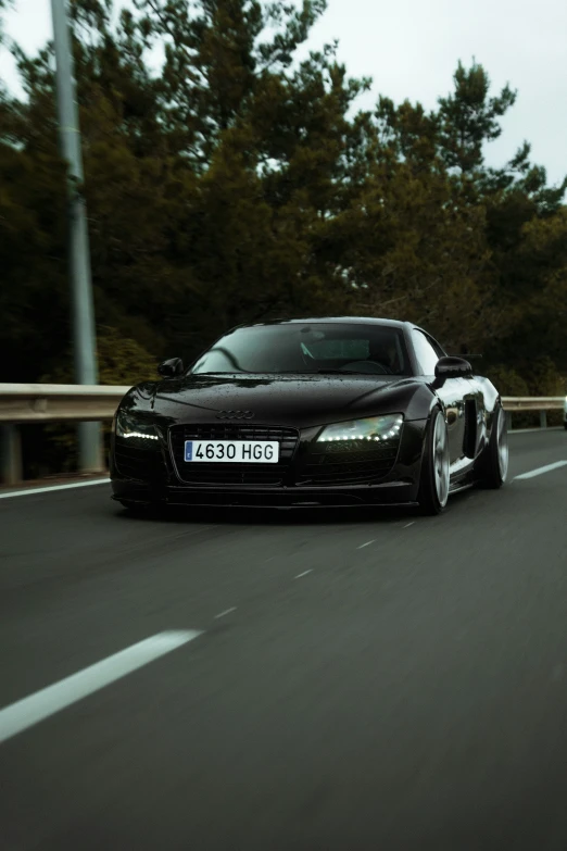 a black sports car on the road