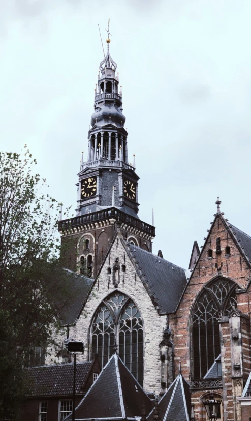 a large church tower with a clock on it's top