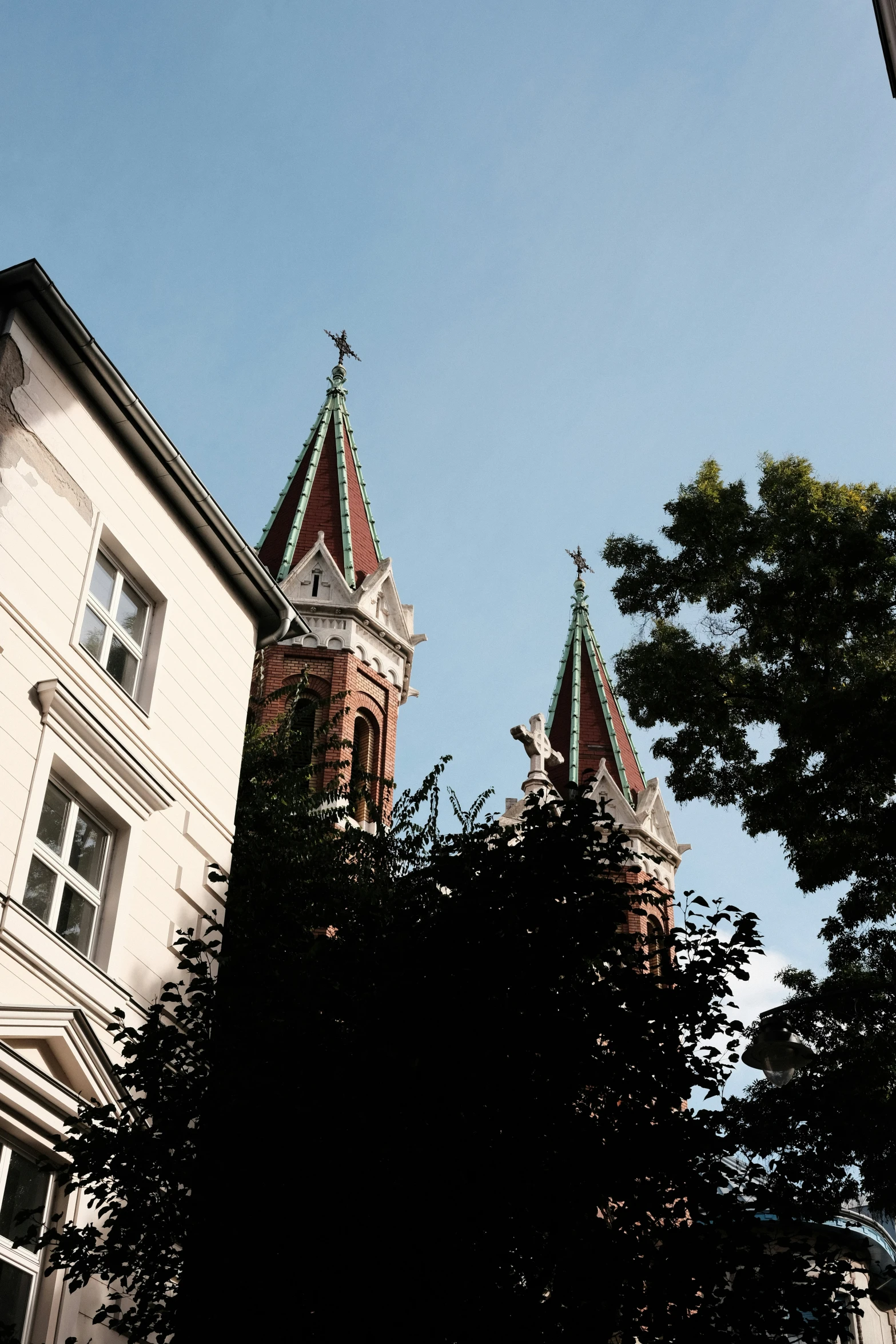 the steeples of an ornate church and other buildings