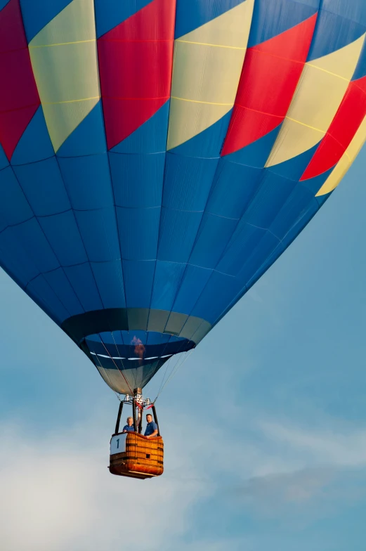 two  air balloons are being lifted by a tow rope