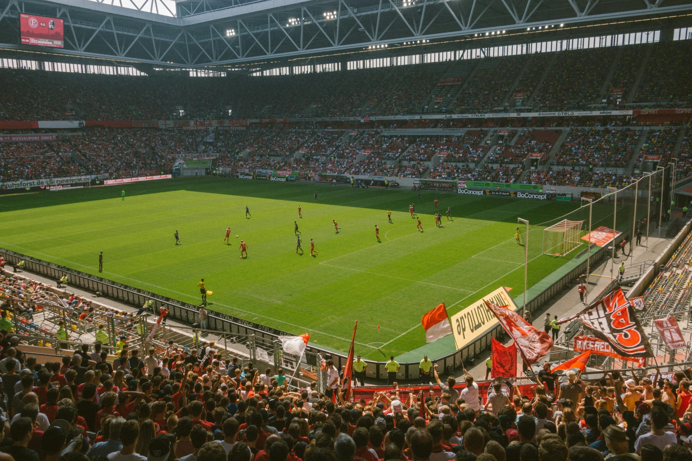 a soccer match in an empty stadium during the day