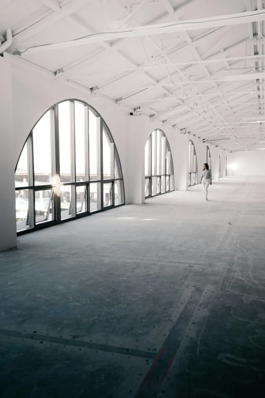 an empty building with the person looking in the distance