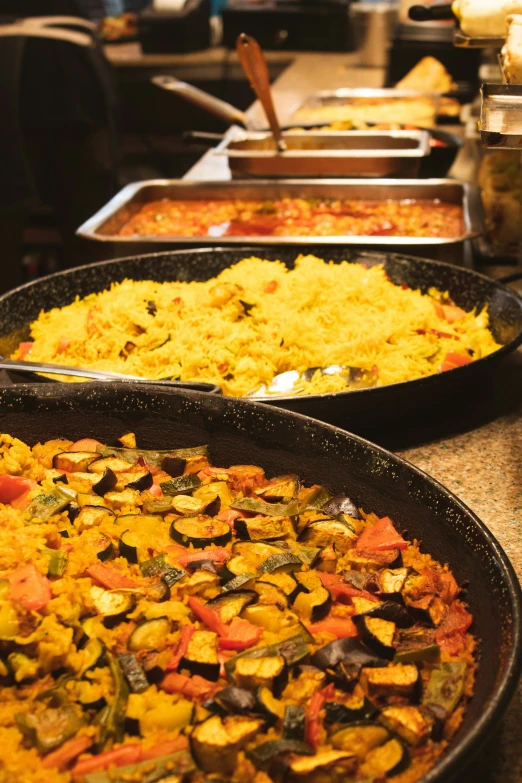 the buffet line has several plates on it