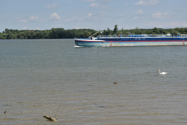 a large ferry traveling on top of a lake