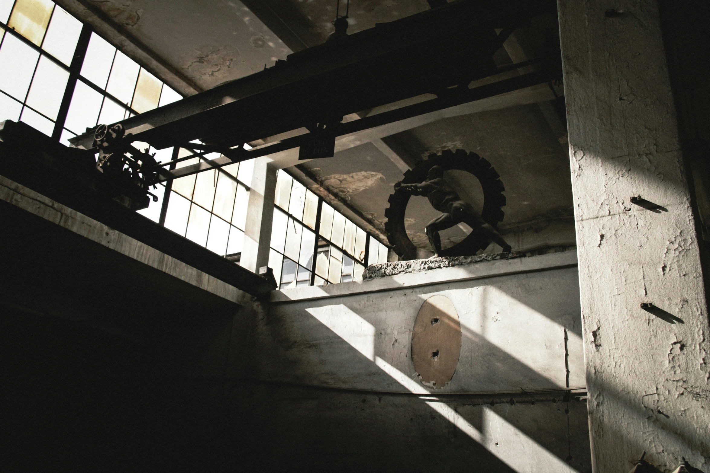 an airplane is flying over the ground by a window