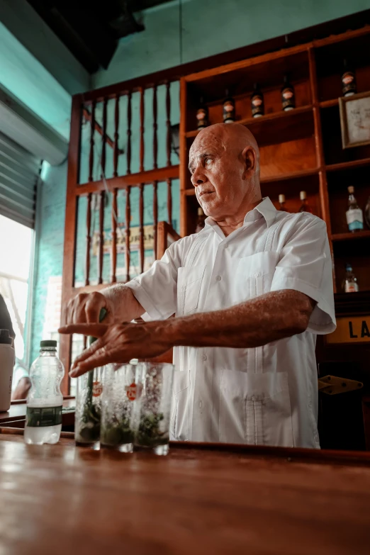 a man that is standing up in front of a counter