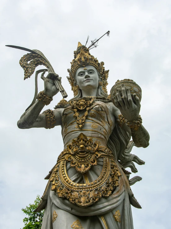 the large statue has a winged figure on top