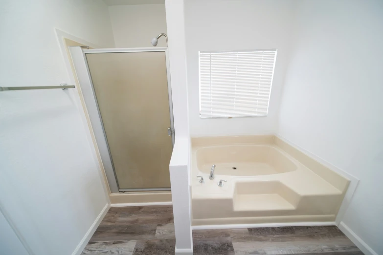 there is an empty bathroom with a walk - in shower and bathtub