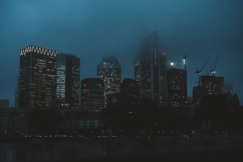 this is an image of city lights in the foggy night