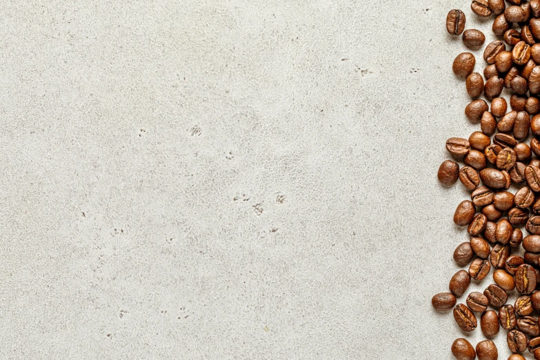 a white table topped with coffee beans