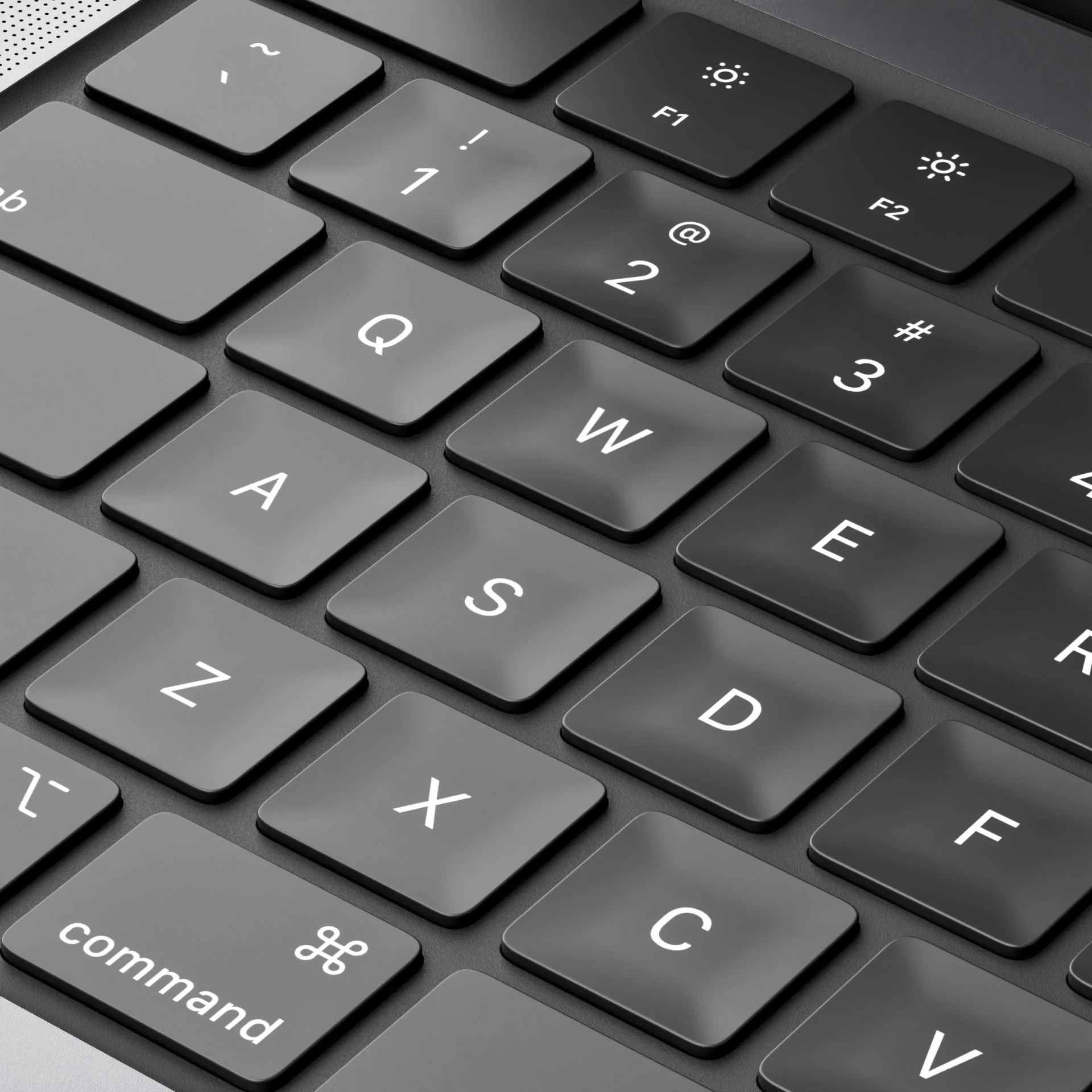 a black and white image of the backlit keyboard of a laptop