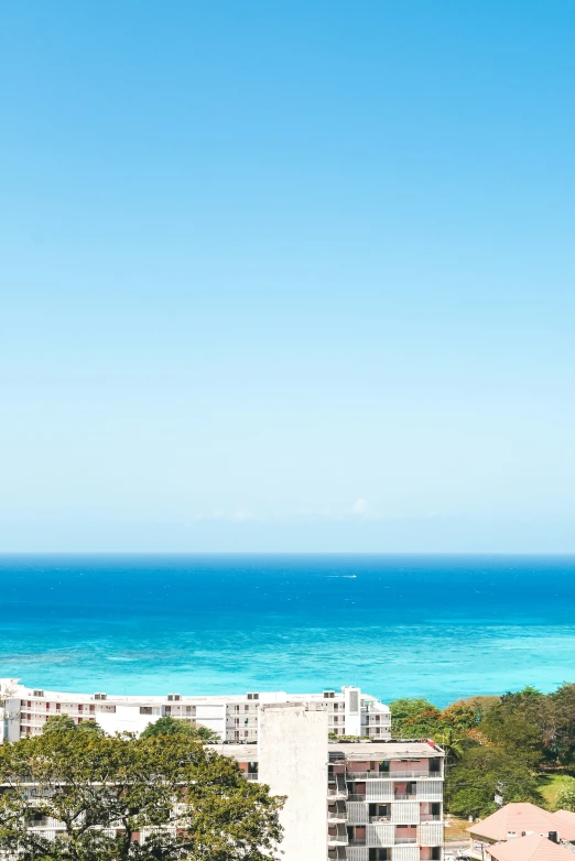 an ocean view from a rooftop near some buildings