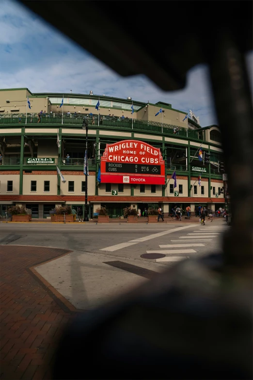 an outside view of a baseball stadium with lots of fans