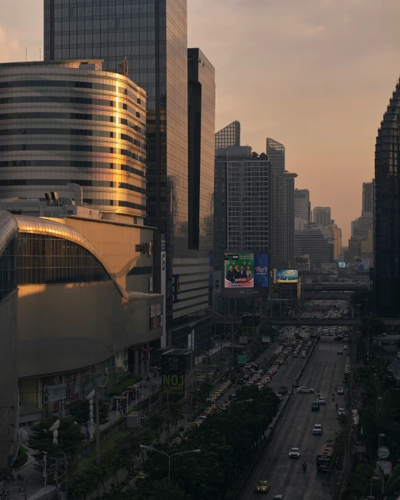 city buildings in downtown with cars driving on the road