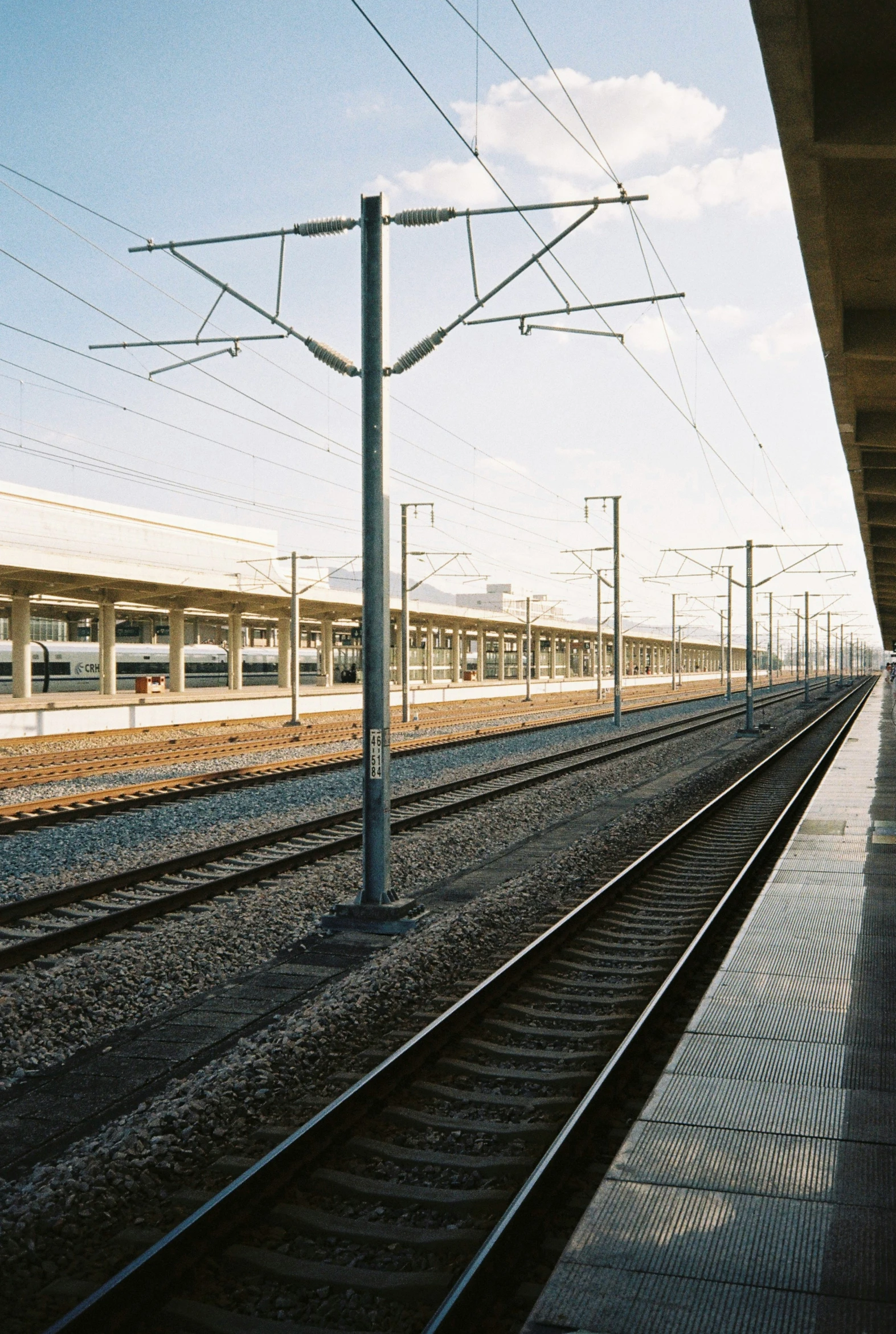 an empty train station, with the railway and other tracks