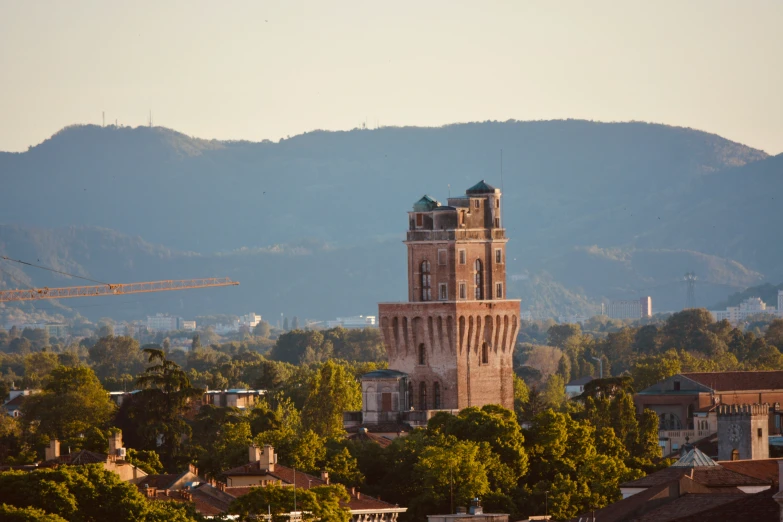 there is an old clock tower in the middle of town