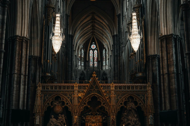 a gothic stone cathedral with ornate gold designs