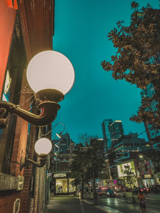 street light with large white ball hanging from it