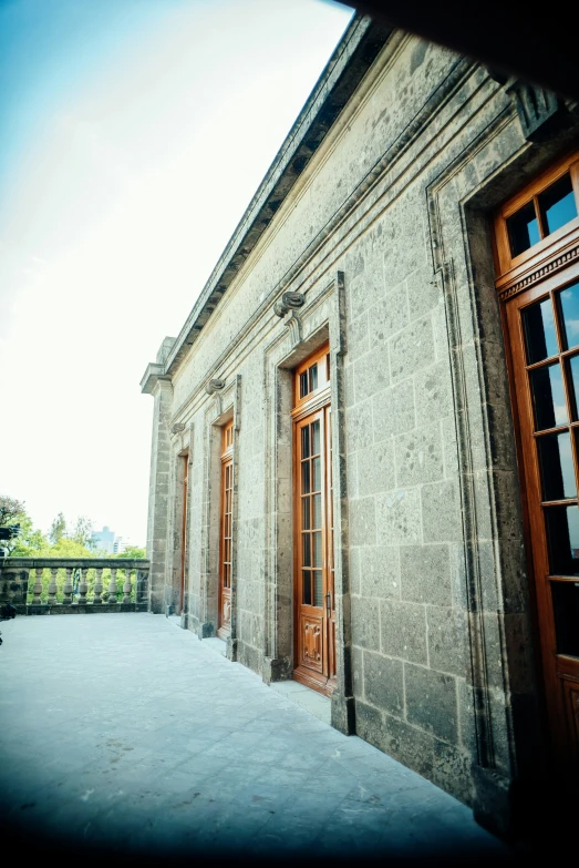 there is a large building with two doors and a railing