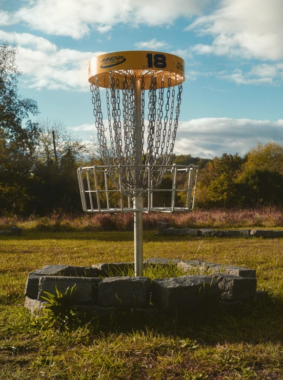 a frisbee golf tee is shown at the ground