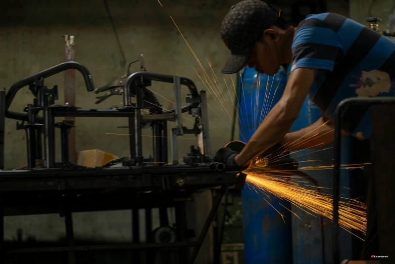a person weldering welding in an industrial setting