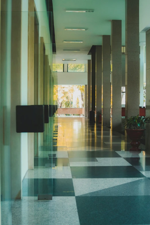 a view down a hallway with mirrors on the walls