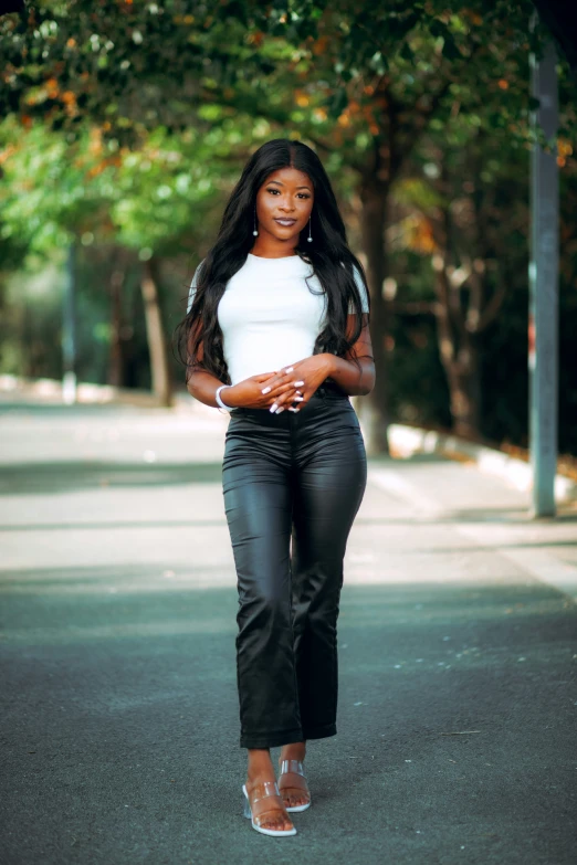 a woman in high heels walking down the street