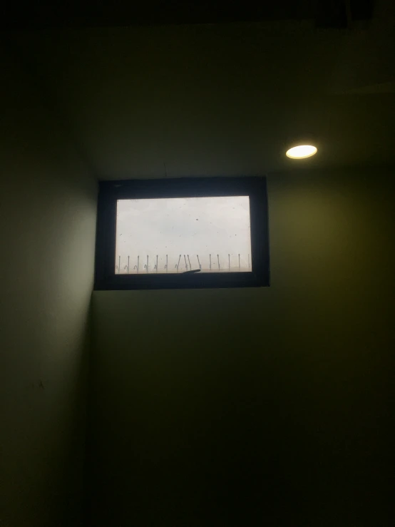 a window is illuminated above a room