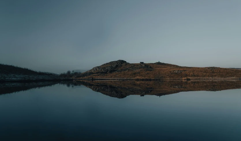 the landscape is black with blue highlights and it looks like soing