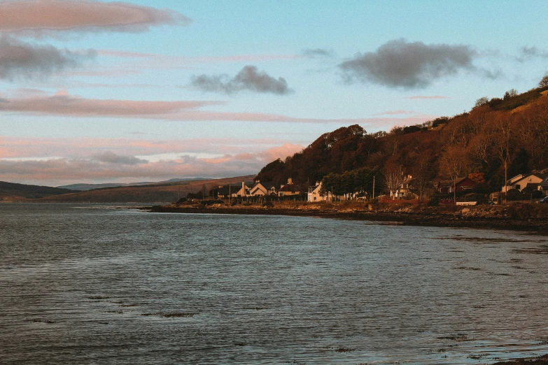 the town is in the distance on the shore