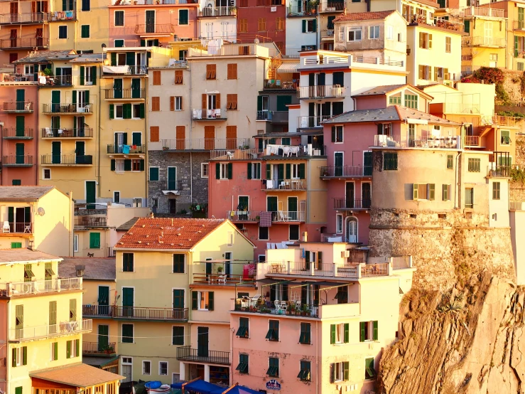 multiple colorful houses of different colors on a cliff face