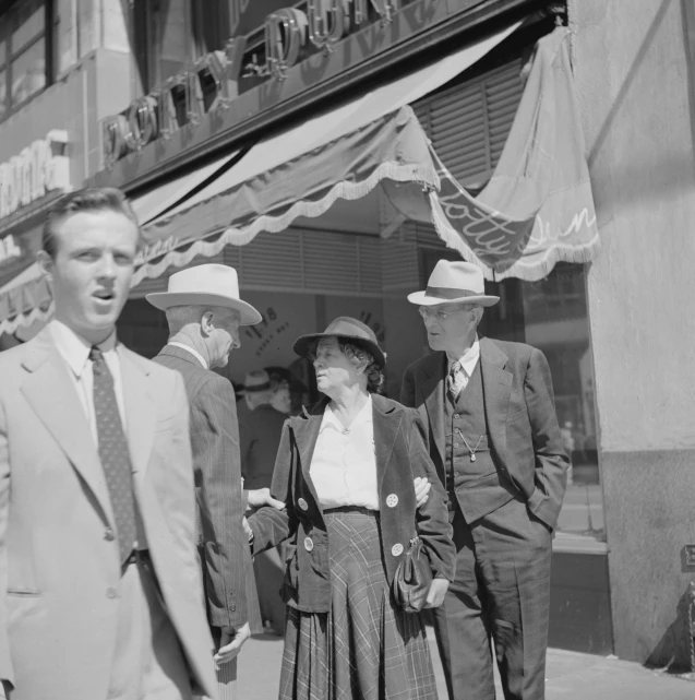 this man and woman are walking down the street