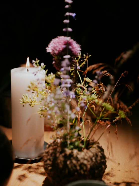 a couple of candles sitting on top of a table