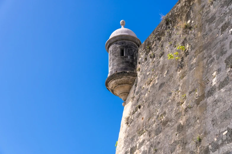 a light house is built on the top of a wall