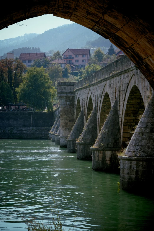 a bridge is built along side of the river