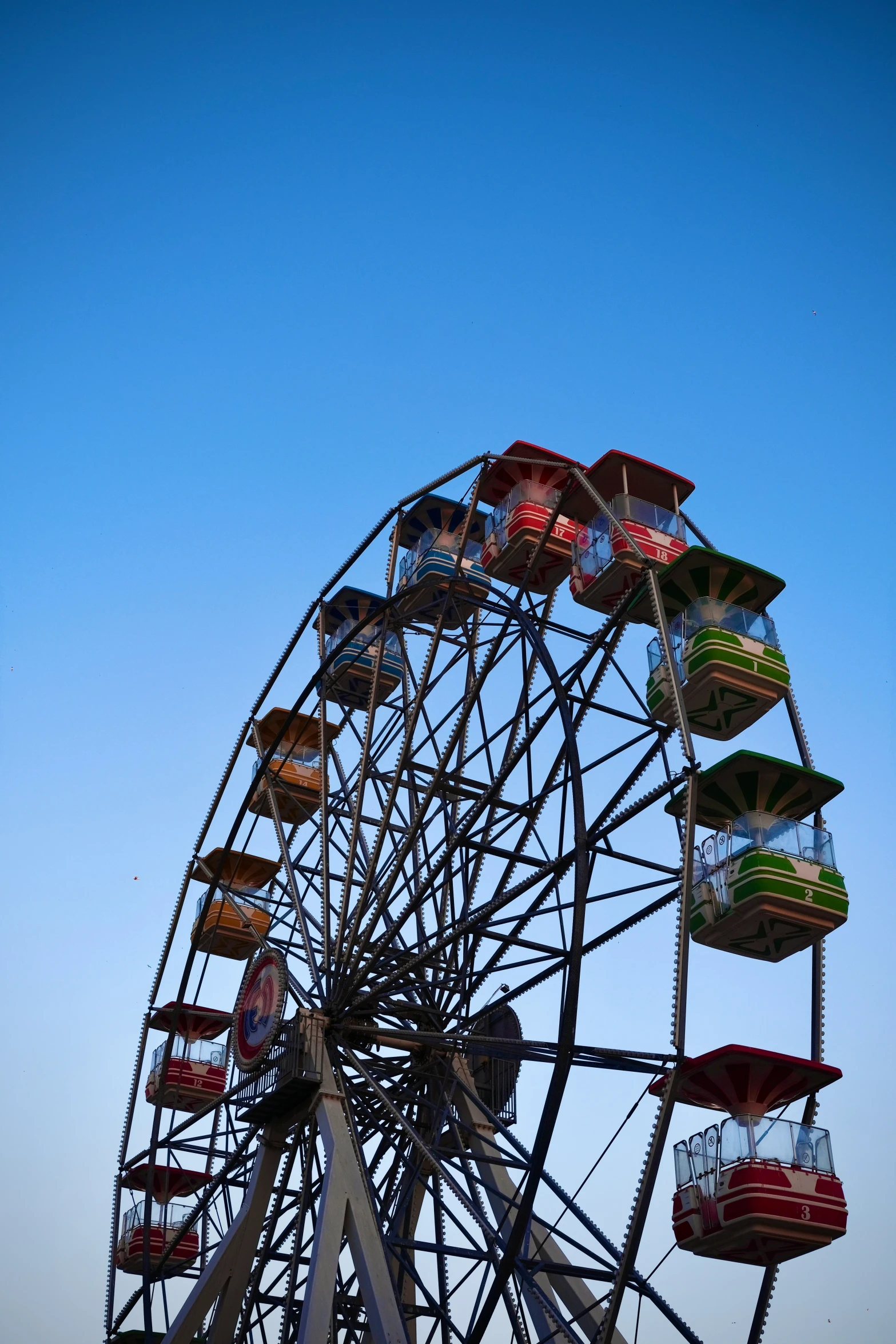 a ferris wheel with many small seats on the top