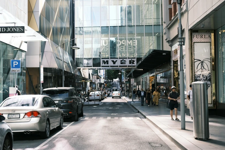 cars parked on the side of a busy city street