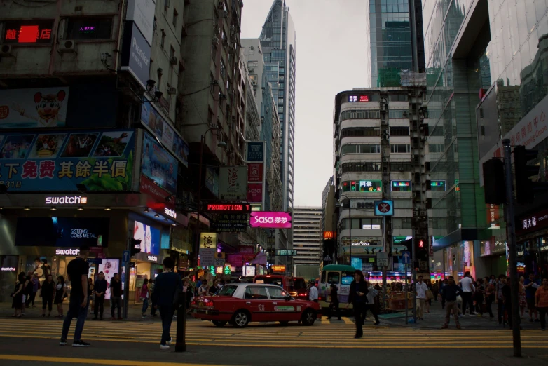 a city street filled with traffic and people