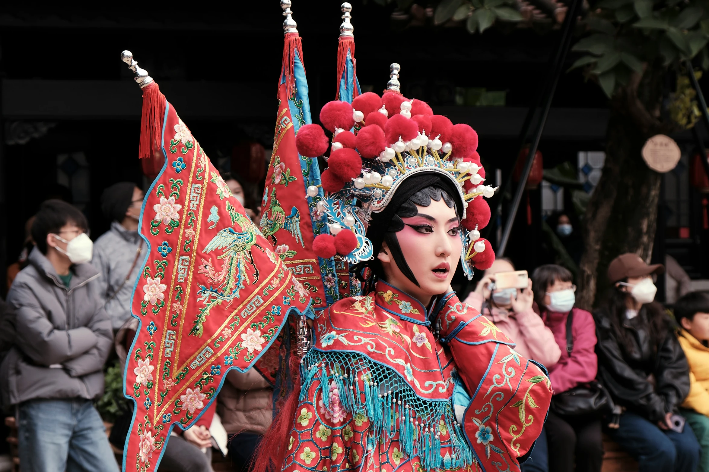 a woman with fancy head dress in a crowd