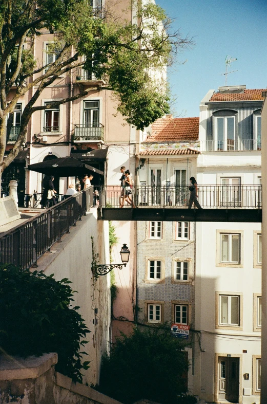 a group of people sitting on the roof of a tall building