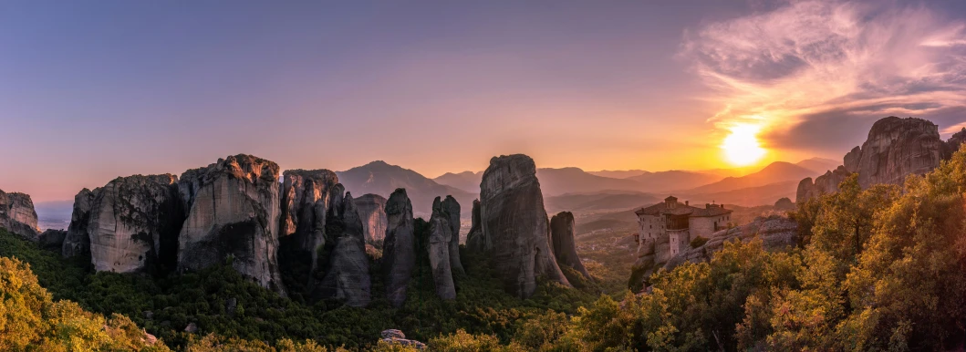 a mountain sunset is seen in this picture