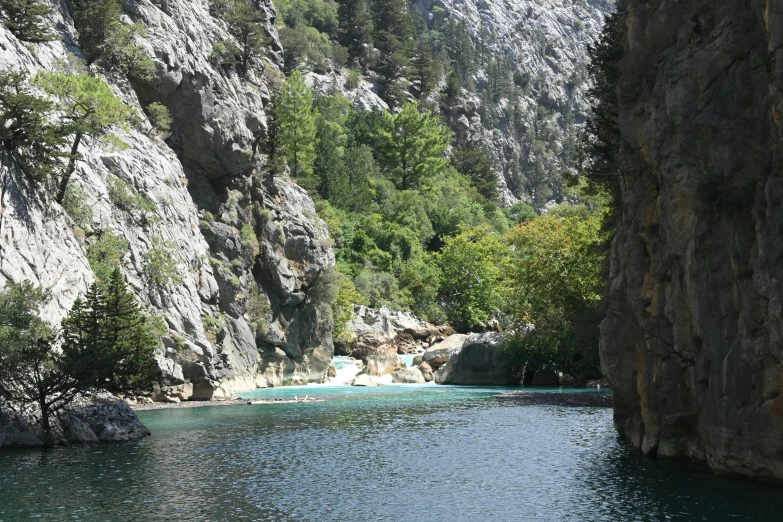 there is a body of water in the middle of the mountains