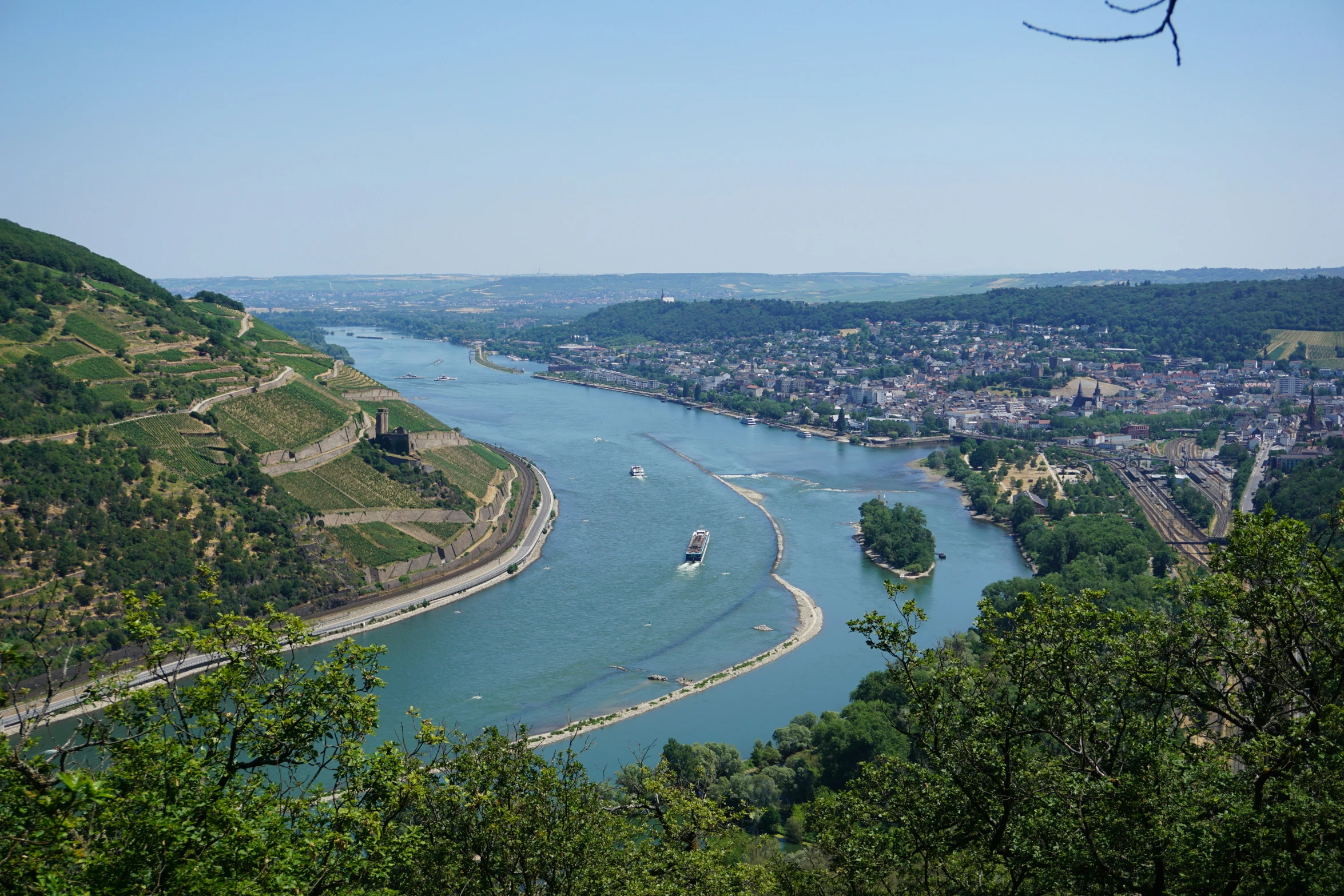 the view from a mountain overlooking a river